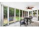 Relaxing screened-in porch overlooking the lush backyard and trampoline at 4274 Timber Trace Road, Loganville, GA 30052