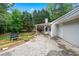 The property features a paved patio area ideal for outdoor entertaining at 4274 Timber Trace Road, Loganville, GA 30052