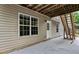 Covered backyard patio with stairs leading to a second level and a view of the backyard at 1897 Alcovy Trace Way Way, Lawrenceville, GA 30045