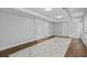 Finished basement featuring multiple entry and exit doors with lighting fixtures at 1897 Alcovy Trace Way Way, Lawrenceville, GA 30045