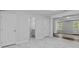 Spacious basement area with an adjacent bathroom and durable floors, perfect for customization at 1897 Alcovy Trace Way Way, Lawrenceville, GA 30045