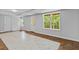 Spacious finished basement with new flooring, a large window, and an exterior door to the backyard at 1897 Alcovy Trace Way Way, Lawrenceville, GA 30045