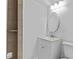 Bathroom featuring a white vanity, oval mirror and updated fixtures at 1897 Alcovy Trace Way Way, Lawrenceville, GA 30045