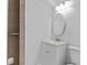 Full bathroom features modern vanity, oval mirror, three-light fixture, and tile flooring at 1897 Alcovy Trace Way Way, Lawrenceville, GA 30045