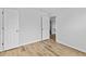 Bedroom showing the entry to a closet and a hallway at 1897 Alcovy Trace Way Way, Lawrenceville, GA 30045