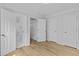 Bedroom features hardwood flooring, multiple closets, and an ensuite bathroom at 1897 Alcovy Trace Way Way, Lawrenceville, GA 30045