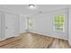 This bedroom offers natural light through dual windows and features a closet and hardwood floors at 1897 Alcovy Trace Way Way, Lawrenceville, GA 30045