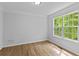 Cozy bedroom with hardwood floors and natural light from a window at 1897 Alcovy Trace Way Way, Lawrenceville, GA 30045