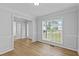 Bright dining room with hardwood floors and an open view to the exterior scenery at 1897 Alcovy Trace Way Way, Lawrenceville, GA 30045