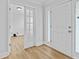 Inviting foyer featuring hardwood floors, a modern front door and a view into the adjacent room at 1897 Alcovy Trace Way Way, Lawrenceville, GA 30045