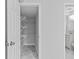 Hallway view leading to a walk-in closet and a full bathroom with modern vanity at 1897 Alcovy Trace Way Way, Lawrenceville, GA 30045