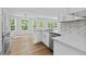 Open-concept kitchen featuring stainless steel appliances, quartz countertops and ample natural light at 1897 Alcovy Trace Way Way, Lawrenceville, GA 30045