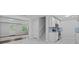 A modern kitchen features stainless appliances and a breakfast bar next to a living space at 1897 Alcovy Trace Way Way, Lawrenceville, GA 30045