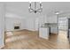 Bright and open living space with a fireplace and a kitchen area at 1897 Alcovy Trace Way Way, Lawrenceville, GA 30045