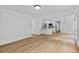 Open-concept living room featuring hardwood floors and white trim at 1897 Alcovy Trace Way Way, Lawrenceville, GA 30045