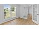 Bright office space featuring hardwood floors, a large window, and glass paneled French doors at 1897 Alcovy Trace Way Way, Lawrenceville, GA 30045
