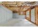 Unfinished basement with concrete walls, visible ceiling, and outdoor access at 1897 Alcovy Trace Way Way, Lawrenceville, GA 30045