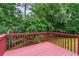 View from the back deck, offering a peaceful outdoor space with lush greenery surrounding the property at 2701 Windsor Nw Ct, Kennesaw, GA 30144