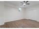 This bedroom offers modern vinyl floors, a ceiling fan, and a closet at 2701 Windsor Nw Ct, Kennesaw, GA 30144