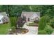 A beautiful home with a two-car garage, red shutters, and neatly trimmed bushes at 2701 Windsor Nw Ct, Kennesaw, GA 30144