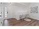 Bright foyer with wood flooring, a stylish ceiling light fixture, and modern wall art at 2701 Windsor Nw Ct, Kennesaw, GA 30144