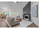 Bright living room featuring a fireplace, hardwood floors, and a view to the dining area at 2701 Windsor Nw Ct, Kennesaw, GA 30144