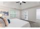 Spacious primary bedroom with plush carpet, ensuite bathroom access, and large window at 2701 Windsor Nw Ct, Kennesaw, GA 30144