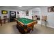 Basement recreation room featuring a pool table and living space with carpeted floor at 2825 Lake Ct, Cumming, GA 30041