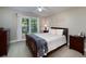 Comfortable bedroom with natural light, matching bedside tables and dressers at 2825 Lake Ct, Cumming, GA 30041