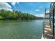 Lake view from the dock, showing a metal staircase that goes into the water at 2825 Lake Ct, Cumming, GA 30041
