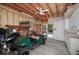 Spacious garage with ample storage, a golf cart, and an open door to the outside at 2825 Lake Ct, Cumming, GA 30041