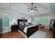 Spacious primary bedroom with hardwood floors, trey ceiling, and large windows at 2825 Lake Ct, Cumming, GA 30041