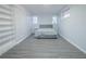 Bright room featuring wood flooring and multiple windows at 3893 Bonnie Se Ln, Atlanta, GA 30354