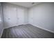 This bedroom features neutral walls and gray wood-look floors at 3893 Bonnie Se Ln, Atlanta, GA 30354