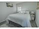 Comfortable bedroom features soft white bedding, and neutral decor creating a peaceful and relaxing atmosphere at 3893 Bonnie Se Ln, Atlanta, GA 30354