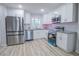 Modern kitchen features stainless steel appliances, granite countertops, and ample cabinet space for efficient cooking at 3893 Bonnie Se Ln, Atlanta, GA 30354