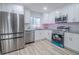 Bright kitchen features stainless steel appliances, granite countertops and modern cabinets for a great cooking experience at 3893 Bonnie Se Ln, Atlanta, GA 30354