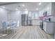 Well-lit kitchen features stainless steel appliances, white cabinetry, and a cozy dining area for modern living at 3893 Bonnie Se Ln, Atlanta, GA 30354