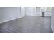 Open-concept living space with stylish gray flooring and freshly painted walls at 3893 Bonnie Se Ln, Atlanta, GA 30354