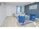 Bright living room with neutral walls and two blue chairs, offering a relaxed and inviting space at 3893 Bonnie Se Ln, Atlanta, GA 30354