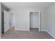 Bedroom with plush carpet, an open double closet and a doorway. The plush carpeting offering comfortable flooring at 7250 Old Chapel, Atlanta, GA 30349