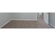 Bedroom featuring neutral paint and plush carpet with an open door. The plush carpeting offers comfortable flooring at 7250 Old Chapel, Atlanta, GA 30349