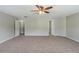 Spacious bedroom featuring neutral walls, soft carpet, and a ceiling fan with light fixture at 7250 Old Chapel, Atlanta, GA 30349
