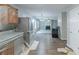 Kitchen/living room view during renovations. Features luxury vinyl plank flooring at 7250 Old Chapel, Atlanta, GA 30349