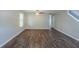 Spacious living room features luxury vinyl plank flooring and lots of natural light at 7250 Old Chapel, Atlanta, GA 30349