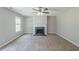 Spacious living room with neutral paint and a cozy fireplace with white mantle and dark hearth at 7250 Old Chapel, Atlanta, GA 30349