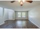 Bright living room features luxury vinyl plank flooring and a soaring ceiling at 7250 Old Chapel, Atlanta, GA 30349