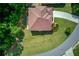 Aerial view of a home with a well-maintained roof, surrounded by green lawns and mature trees at 764 Morganton Dr, Johns Creek, GA 30024