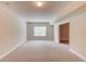 Finished basement space with natural light and an open doorway at 764 Morganton Dr, Johns Creek, GA 30024