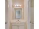 Bathroom with a white vanity, bright lighting, and a large mirror at 764 Morganton Dr, Johns Creek, GA 30024